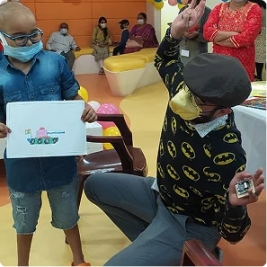 Patients and volunteers with art work
